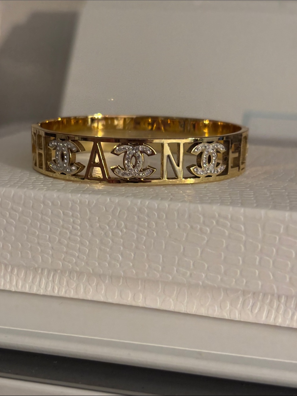 Fashion Jewelry Gold-Tone Logo Cutout Bangle with Clear Crystal Accents